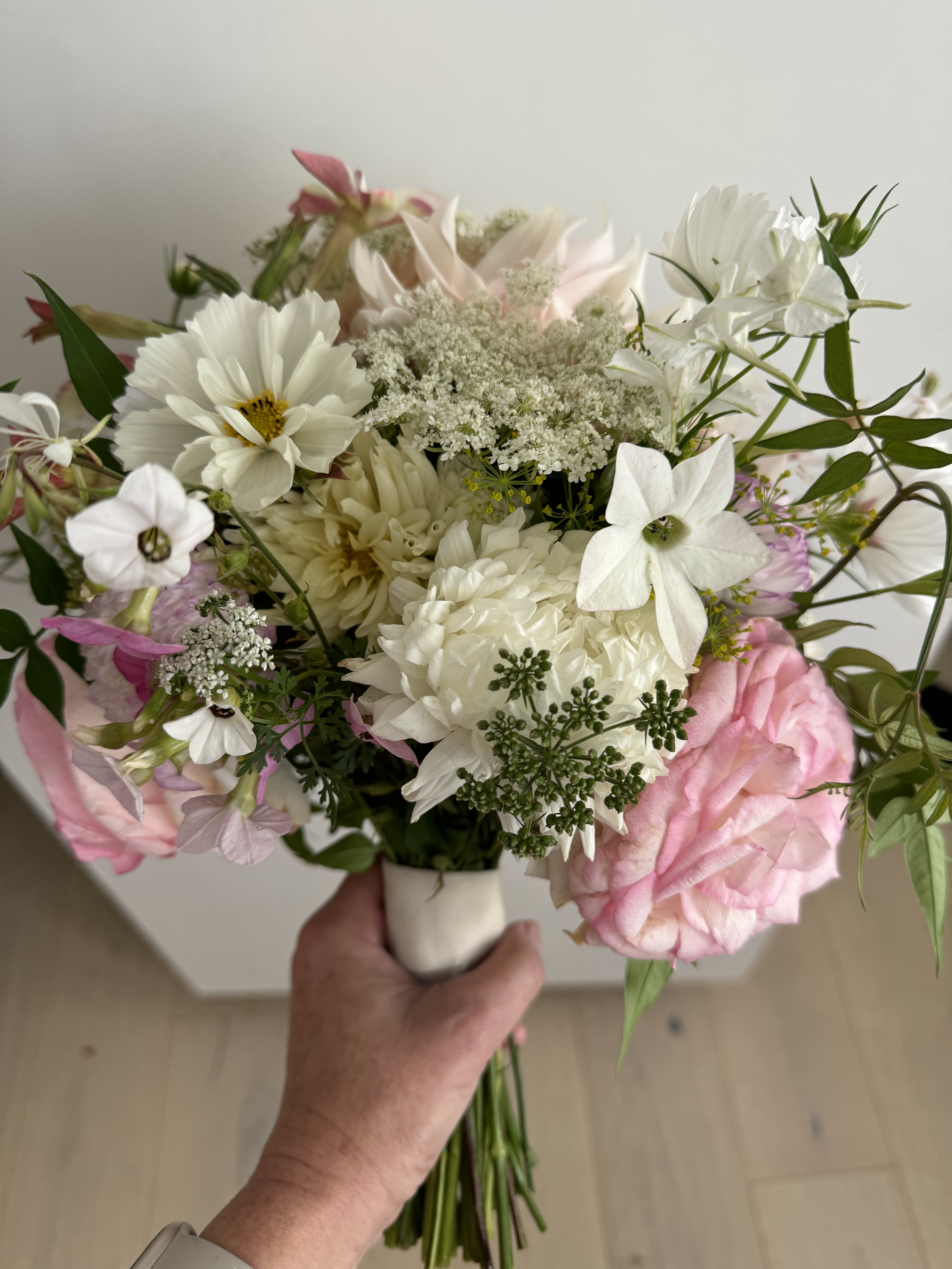 Person making a Bouquette of flowers